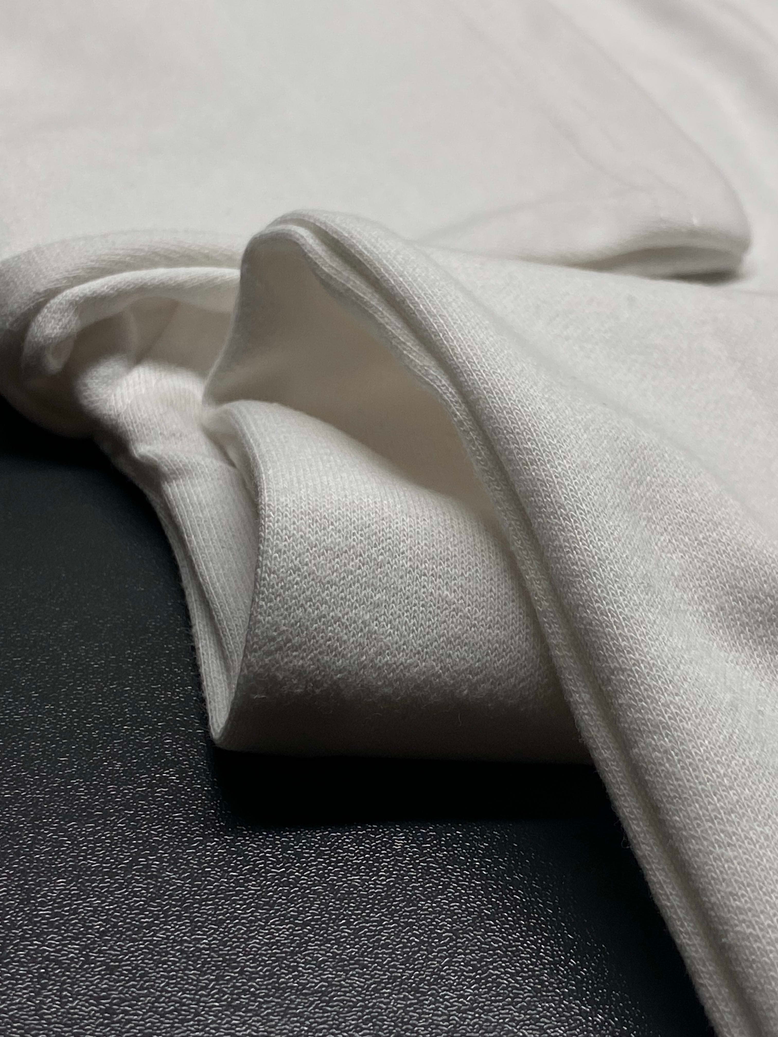 Dusty rose heather fabric showing clean hem stitching